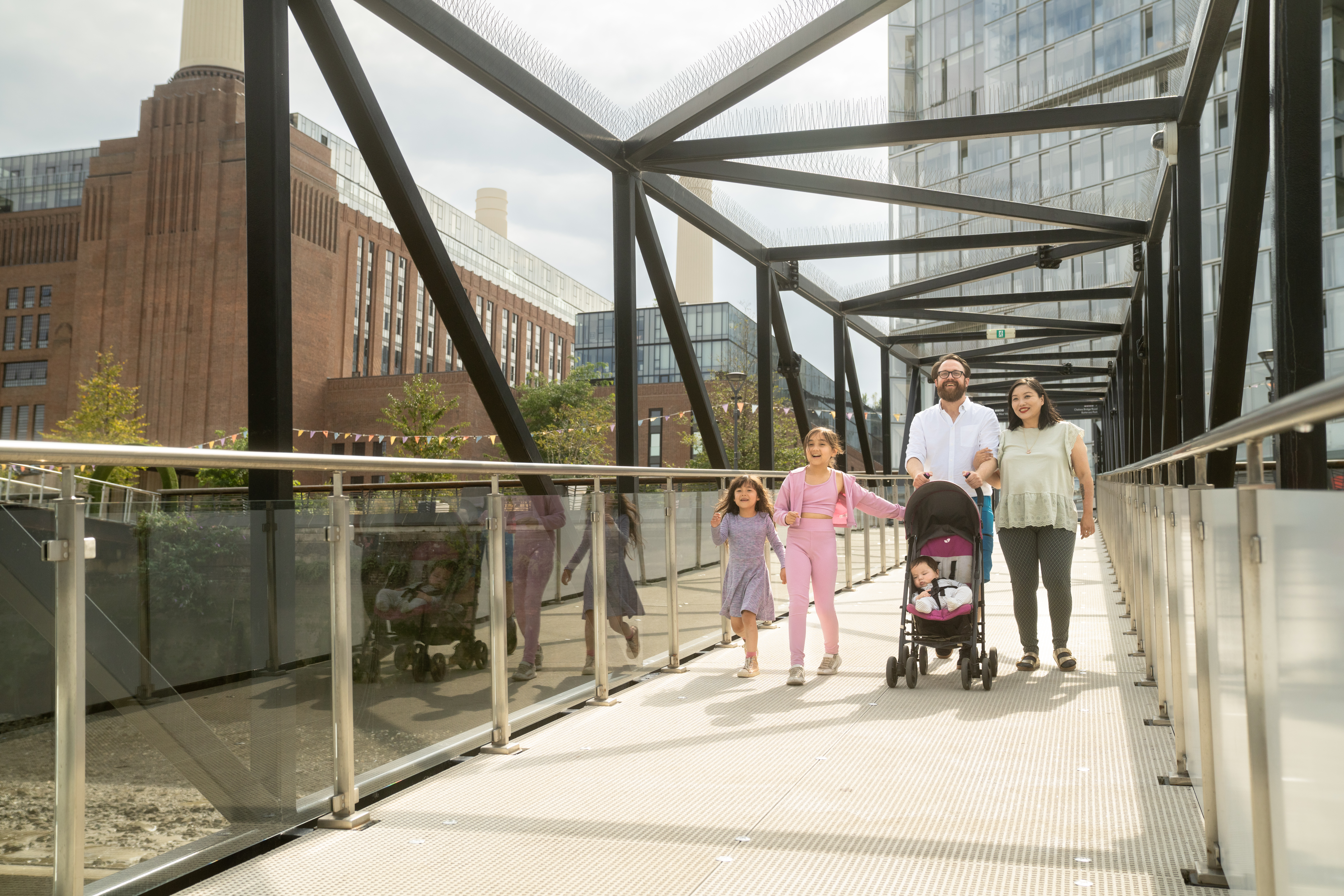 Family going down the brown at Battersea Power Station Pier
