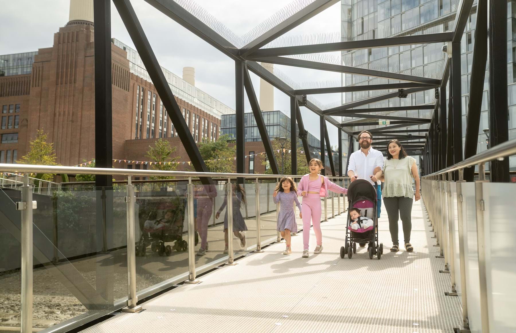 Family going down the brown at Battersea Power Station Pier